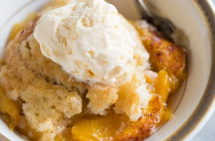 Delicious old fashioned peach cobbler with golden crust and fresh peaches