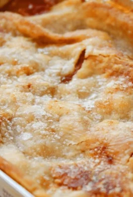 Delicious Patti Labelle's Peach Cobbler served in a rustic dish