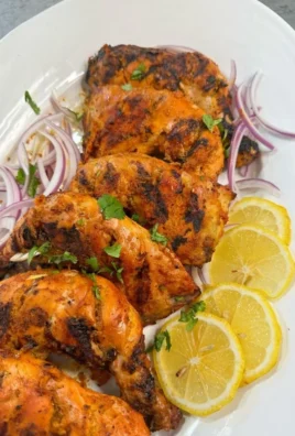 Grilled peri peri chicken served with fresh veggies and spicy sauce