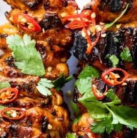Grilled Peri-Peri Chicken Skewers with spices and herbs