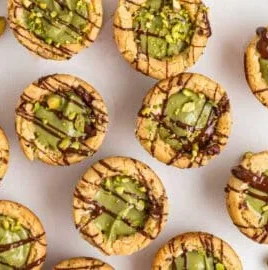 Delicious Pistachio Cream Cookie Cups topped with creamy filling and pistachio nuts