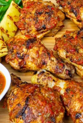 Plate of simplified peri peri chicken garnished with fresh herbs.