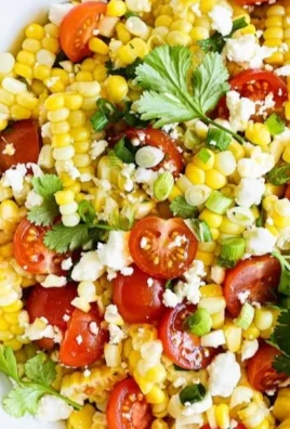 Delicious summer sweet corn feta salad with vibrant vegetables and herbs.
