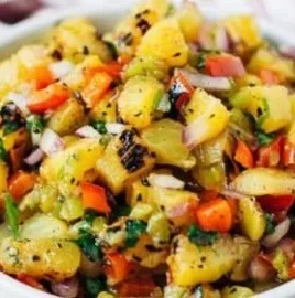 A vibrant bowl of sweet and spicy pineapple salsa with fresh ingredients