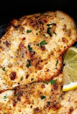 Air Fryer Garlic Parmesan Chicken served with herbs and spices