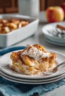 Apple Cinnamon Cottage Cheese Bake served in a dish with a sprinkle of cinnamon on top.