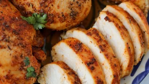 Baked boneless skinless chicken breasts served with vegetables