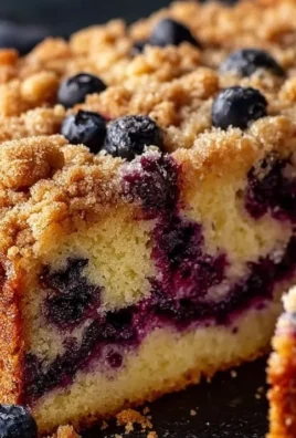 Delicious homemade blueberry coffee cake with fresh blueberries and a crumb topping