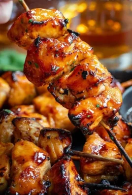 Delicious Bourbon Chicken Skewers served on a platter.