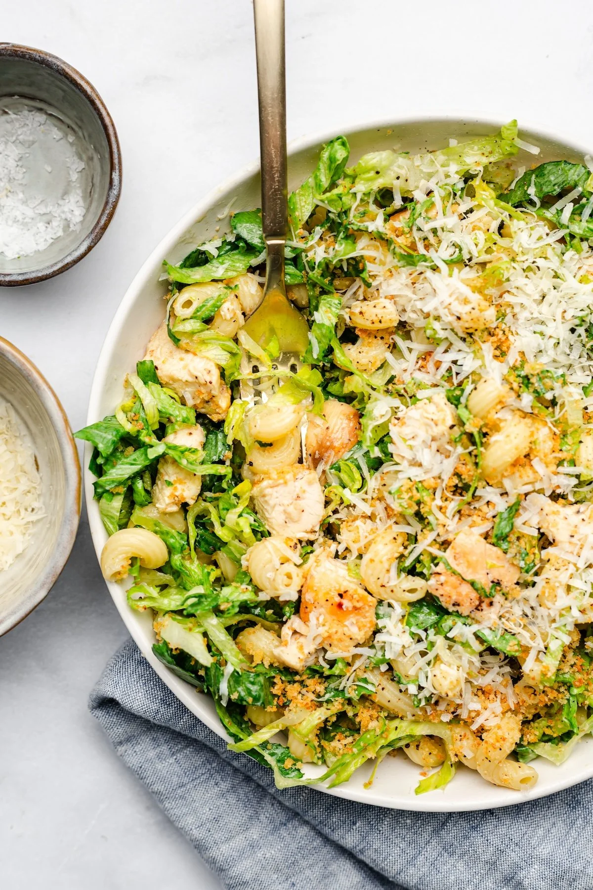 Delicious Chicken Caesar Pasta Salad in a bowl with fresh toppings.