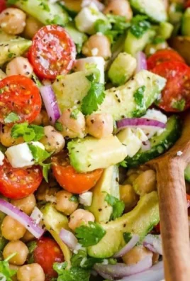 Colorful chickpea salad with fresh vegetables in a bowl