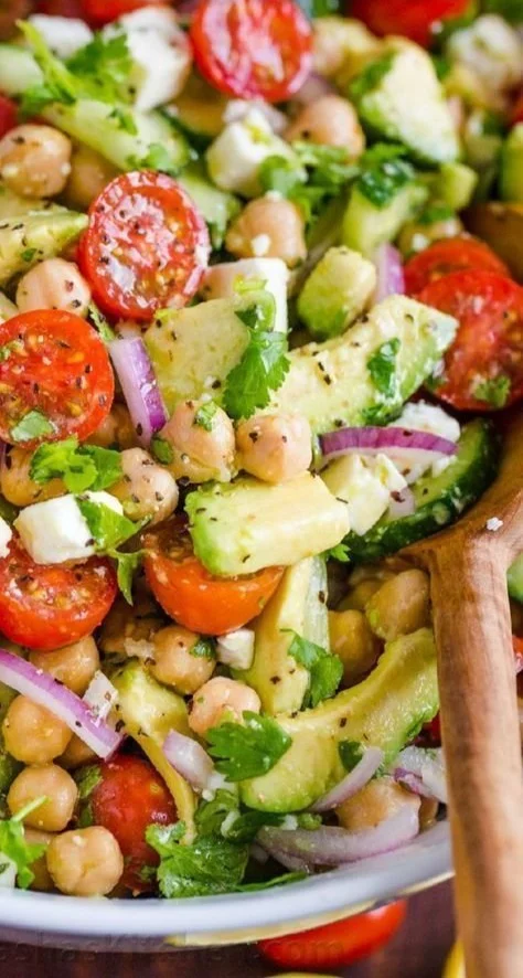 Colorful chickpea salad with fresh vegetables in a bowl