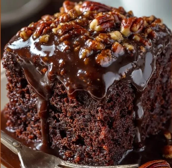 Delicious Coca-Cola Cake topped with frosting and chocolate decorations