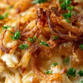 French Onion Chicken Orzo Casserole topped with melted cheese