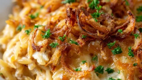 French Onion Chicken Orzo Casserole topped with melted cheese
