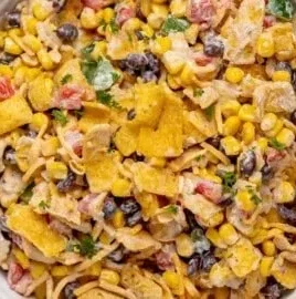 Delicious Frito Corn Salad served in a bowl with colorful ingredients.