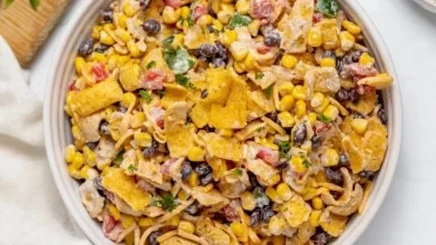 Delicious Frito Corn Salad served in a bowl with colorful ingredients.