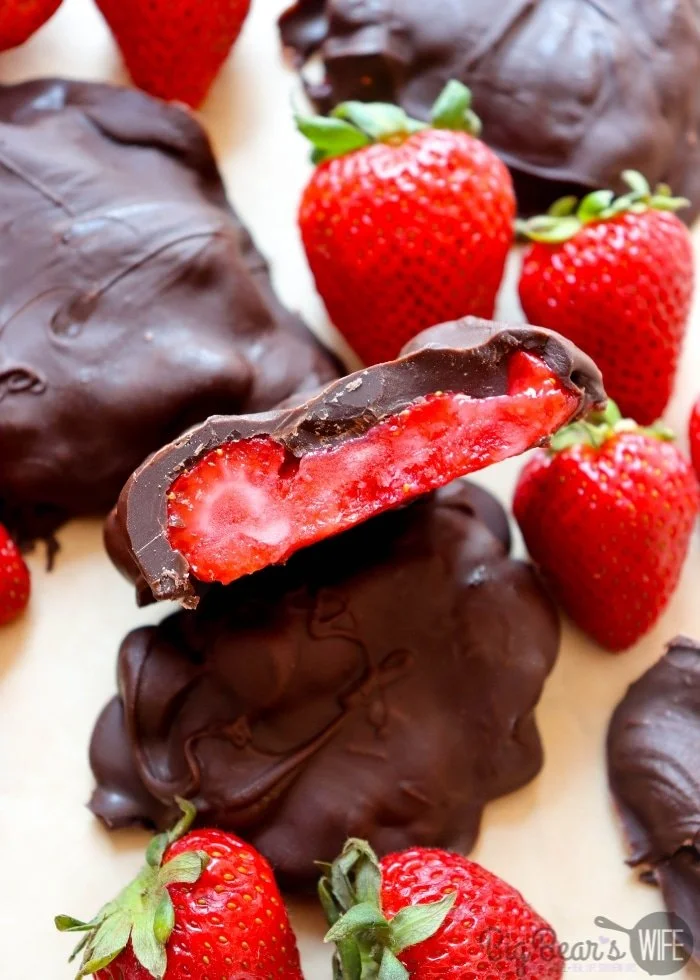 Frozen chocolate covered strawberry bites ready to be served as a dessert.