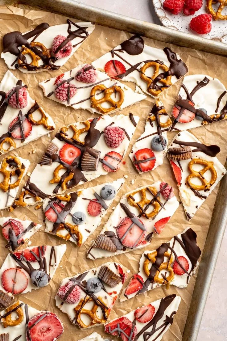 Delicious frozen yogurt bark topped with fruit and nuts.