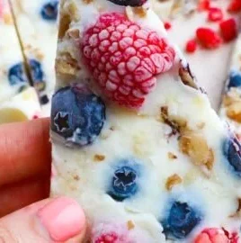 Delicious frozen yogurt bark topped with fruits and nuts