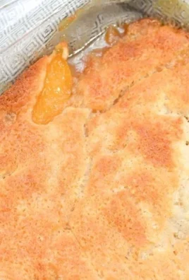 Delicious homemade Georgia peach cobbler with fresh peaches and golden crust