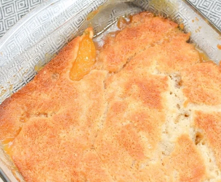 Delicious homemade Georgia peach cobbler with fresh peaches and golden crust