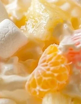 Hawaiian Fruit Salad with Cool Whip served in a colorful bowl
