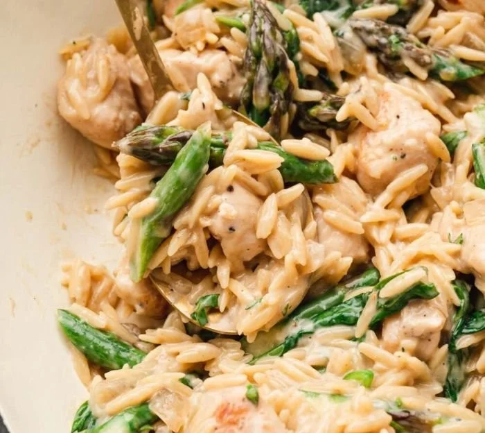 High protein chicken orzo dish with fresh vegetables and herbs