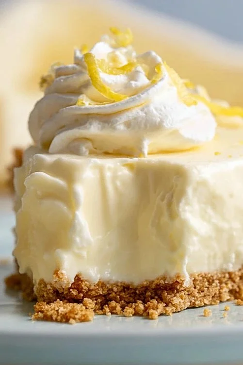 Irresistible no bake lemon pie topped with lemon slices and whipped cream