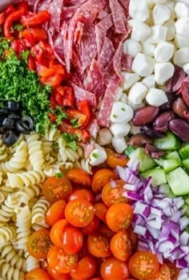 Colorful Italian Pasta Salad with fresh vegetables and dressing
