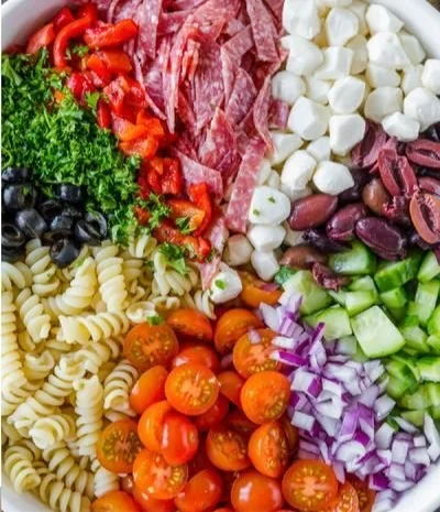 Colorful Italian Pasta Salad with fresh vegetables and dressing