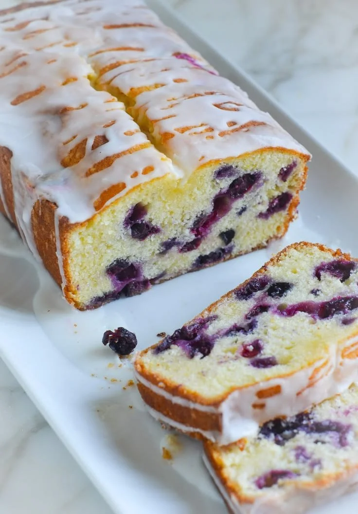 Delicious Lemon Blueberry Pound Cake decorated with fresh berries
