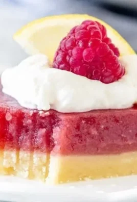 Delicious lemon raspberry bars with a vibrant lemon and raspberry topping.