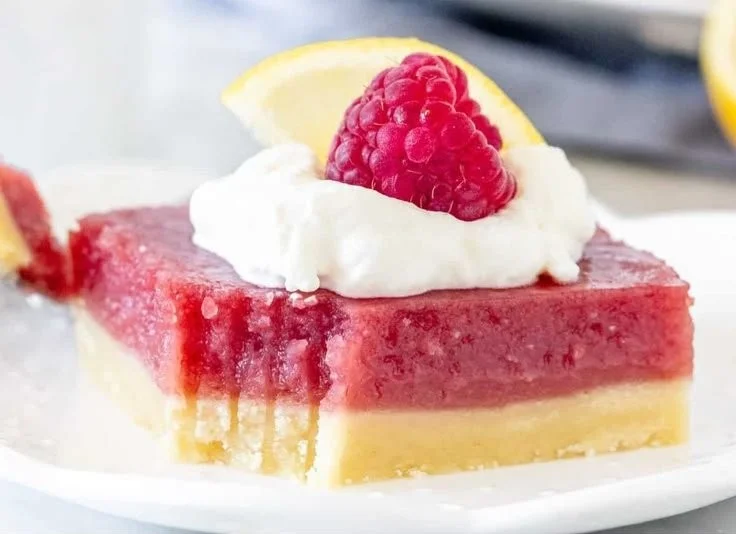 Delicious lemon raspberry bars with a vibrant lemon and raspberry topping.