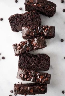 One Bowl Gluten Free Chocolate Zucchini Bread served on a wooden table