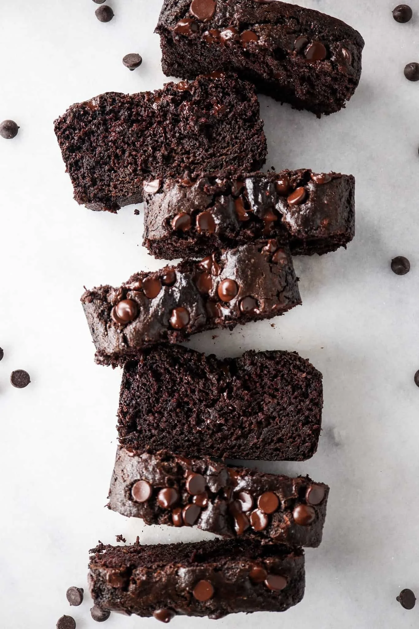 One Bowl Gluten Free Chocolate Zucchini Bread served on a wooden table