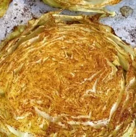 Easy roasted cabbage steaks served on a plate, healthy and low carb dish