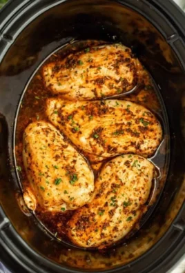 Delicious slow cooker chicken breasts served with vegetables.