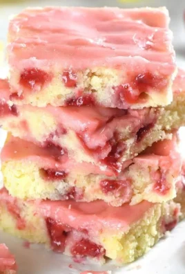 Delicious strawberry lemon blondies topped with fresh strawberries and lemon zest