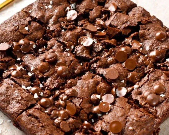 Delicious sugar-free brownies on a wooden table, perfect for diabetic-friendly diets.