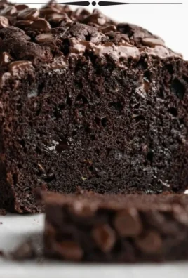 Delicious triple chocolate chip zucchini bread with melted chocolate chunks